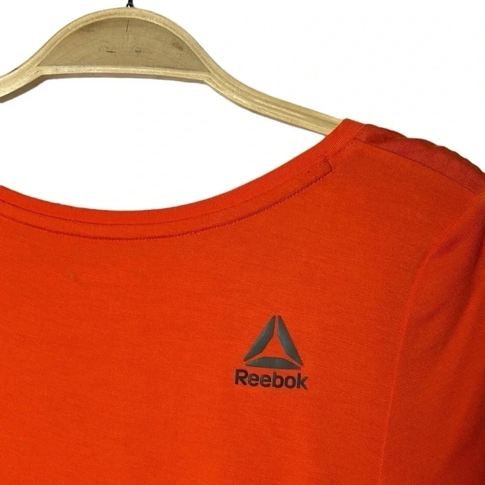REEBOK. Orange activewear tee shirt  . Logos ,scoop neckline , longer cap sleeve - Picture 6 of 7